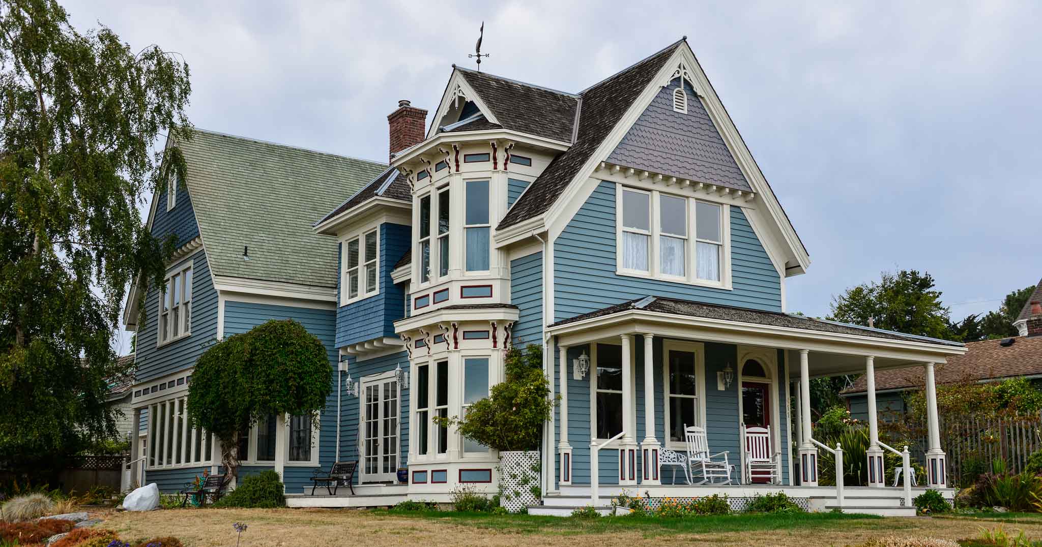 Historic home with blue wood siding